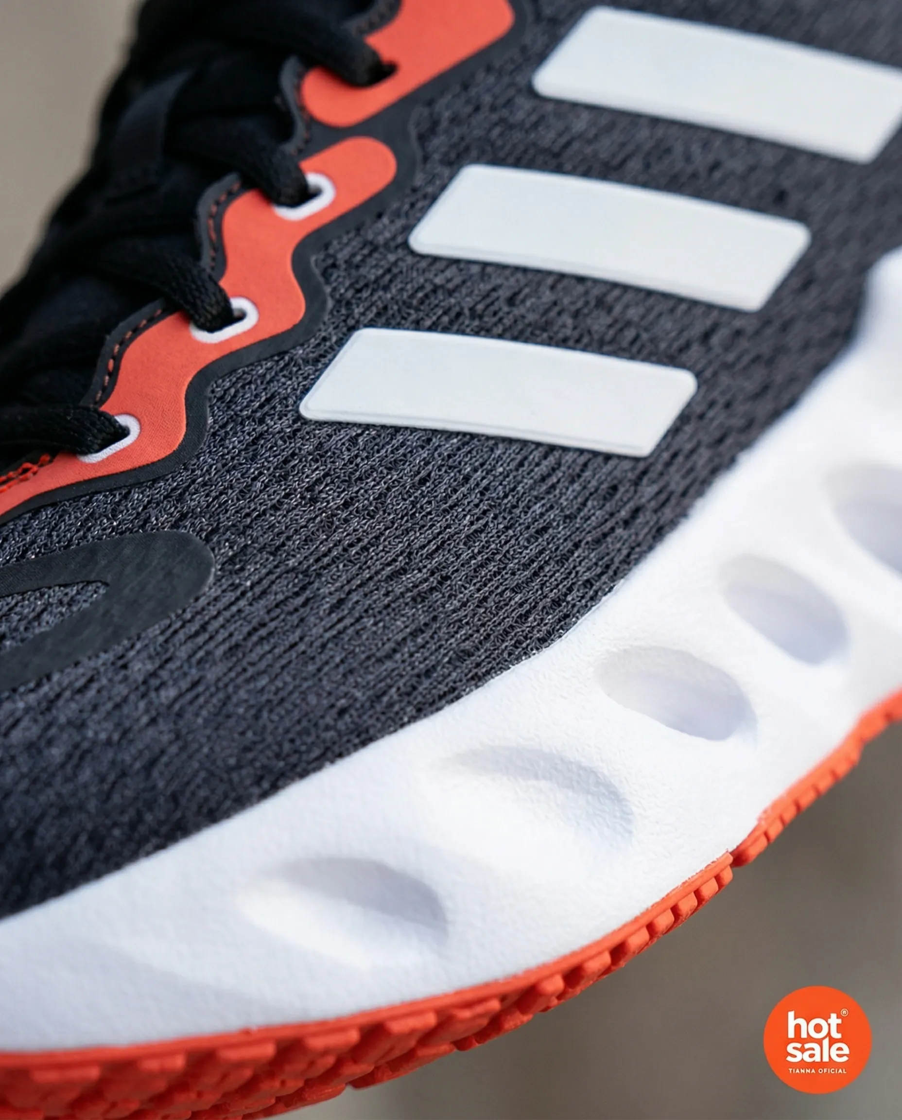 Macro detail image generated with TiendaPop — Adidas sneaker mesh texture and sole with Hot Sale badge